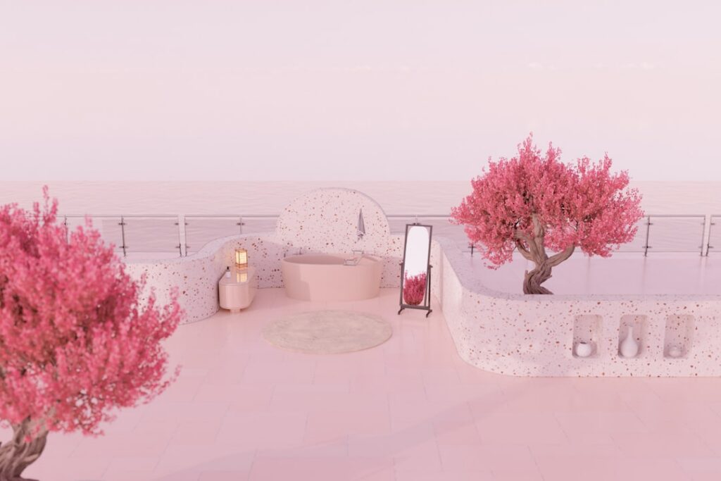 Ceramic piggy bank sits next to a small white model of a house on a clean, bright surface, symbolizing saving money on rea...