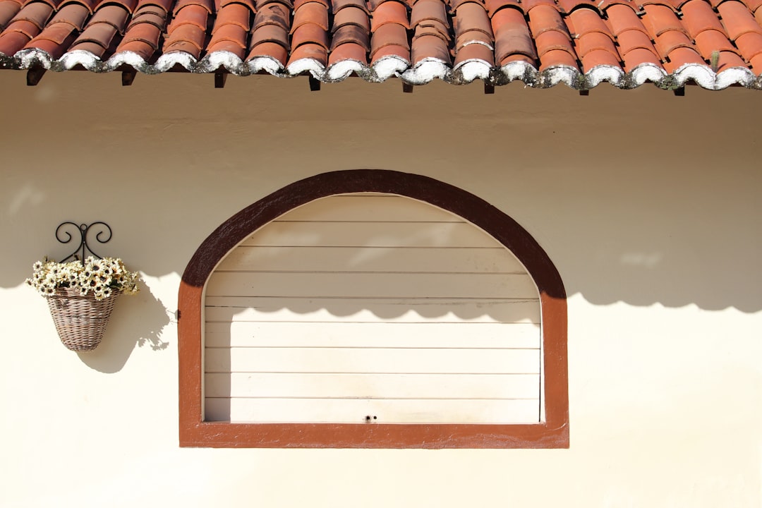 The beautiful sunlit exterior of a modern craftsman-style home, representing a valuable Chattanooga property for sale.