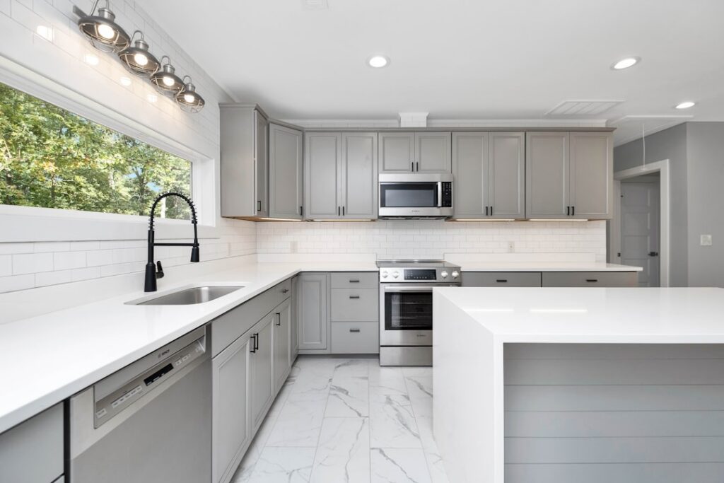 Bright, modern kitchen with brand new appliances, representing the tangible upgrades a Chattanooga home seller could affor...