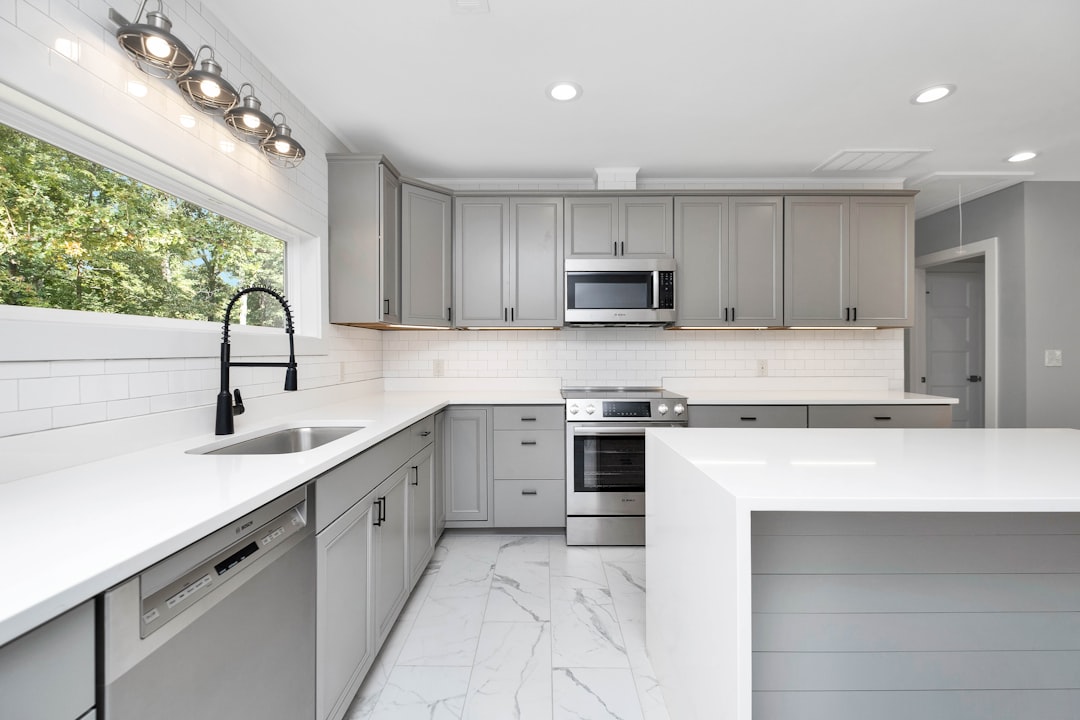 Bright, modern kitchen with brand new appliances, representing the tangible upgrades a Chattanooga home seller could affor...