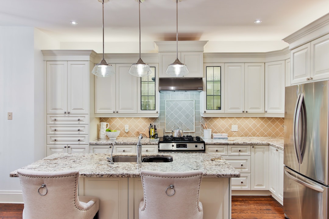 A bright and spacious luxury kitchen with brand-new appliances and marble countertops, showcasing how commission savings can fund a dream home renovation.
