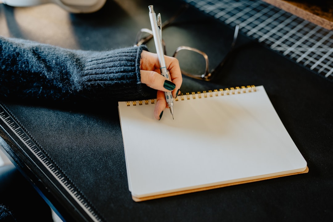 A person carefully reviewing a contract at a clean, modern desk, representing a savvy home seller analyzing real estate commission options.