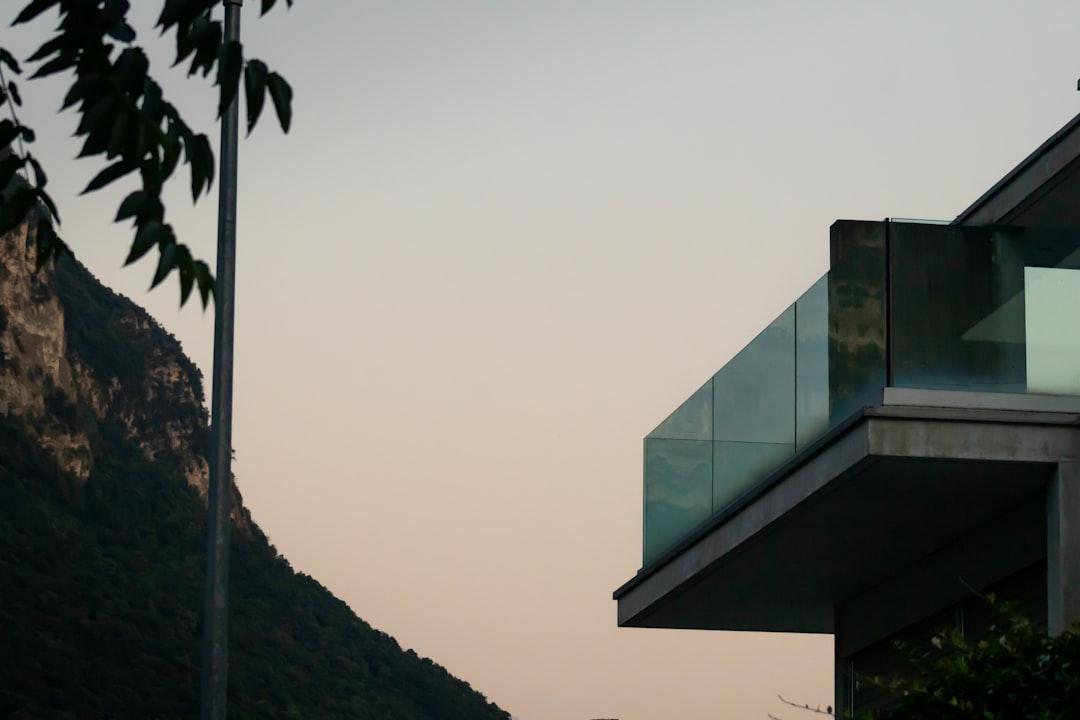 Bright, modern home with large windows overlooking a scenic mountain range, representing a valuable Chattanooga property a...